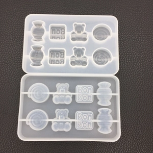 Macro detail of gummy bear and candy silicone resin molds with Bon Bon text engraving
