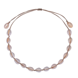Detail of handmade bohemian shell necklace with adjustable braided rope on white background