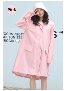 Pink waterproof raincoat detail showing double closure zipper and snap buttons
