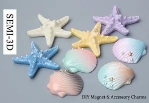 Detail of semi-3D resin starfish and shells for DIY crafts on blue wood background