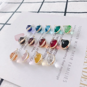 Macro shot of colorful water drop pendants with gold metal edges for DIY jewelry making