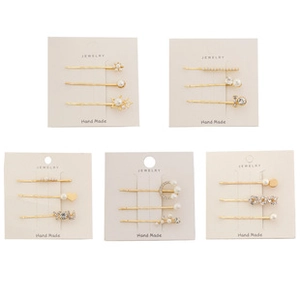 Detailed set of 5 gold metal hair clips with elegant pearls and sparkling rhinestones