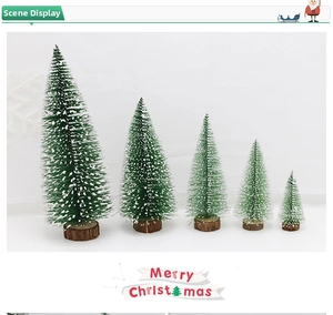 Detailed view of 5 mini Christmas trees with snow spray and natural wooden bases
