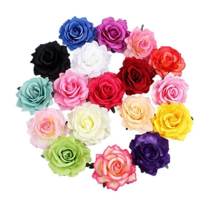 Flat lay of colorful artificial rose hair clips showing various vibrant floral shades