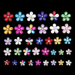 Macro detail of multi-colored flower-shaped rhinestones for DIY jewelry and crafts