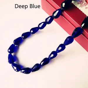 Macro shot of faceted deep blue teardrop crystal beads for jewelry making accessories