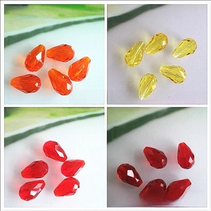 Faceted teardrop glass beads in orange, golden, and bright red for DIY jewelry making
