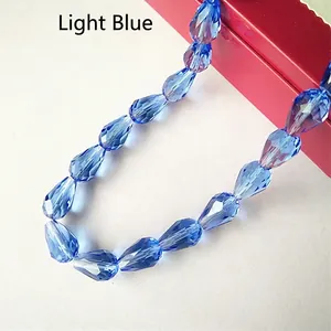 Macro shot of light blue faceted crystal glass teardrop beads for DIY jewelry making