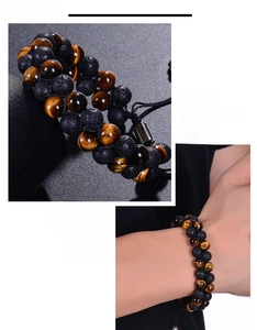 Detail of natural tiger eye and lava stone double-row braided bracelet on wrist