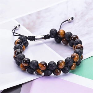 Double-layered braided bracelet featuring natural tiger eye stone and black lava rock beads