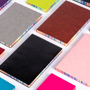 Rainbow edged soft PU leather notebooks in multiple colors on a white background