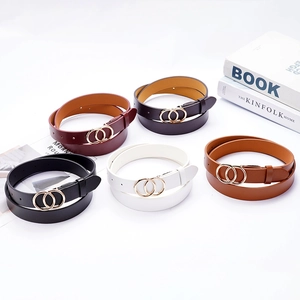 Various colors of fashion belts for women with gold double-ring buckles on white background