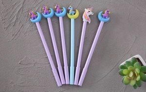 Detail view of 6 cute cartoon unicorn gel pens with purple and light blue silicone toppers