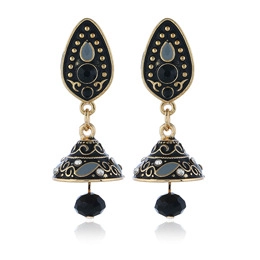 Detail of bohemian sun flower earrings with black enamel drop and golden bell-shaped charm