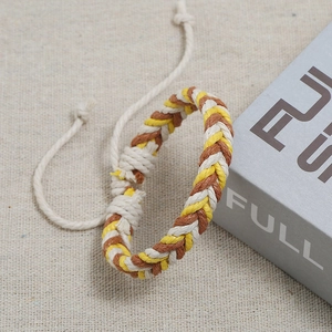 Detailed close-up of handmade woven bohemian bracelet with adjustable slide knot
