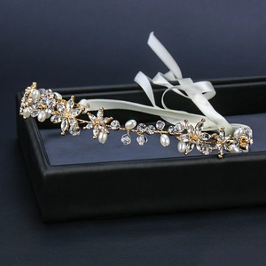 Exquisite gold bridal headband with crystal flowers and pearls in a black gift box
