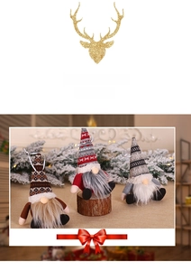 Close-up of three handmade Christmas gnomes with knitted hats and long white beards