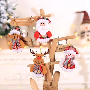 Set of four plush Christmas ornaments including Santa, Reindeer, Bear, and Snowman