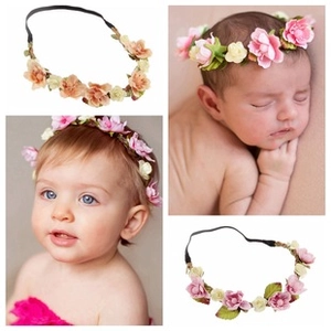Detail of floral infant headbands with soft artificial petals and elastic band