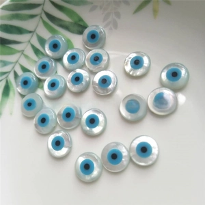 Macro detail of natural mother of pearl evil eye loose beads for jewelry making DIY