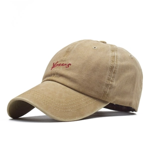 Detail of red Yours embroidery on khaki washed cotton vintage style baseball cap