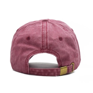 Detail of vintage washed cotton baseball cap with adjustable bronze metal buckle back