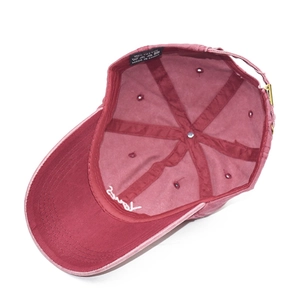 Detail view of cotton baseball cap interior showing metal buckle and brim embroidery