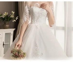 Exquisite detail of lace embroidery and heart-shaped neckline on a white wedding dress
