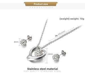 Detail view of heart necklace and rhinestone earrings with technical dimensions and specs