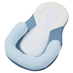 Breathable blue and white baby sleep positioner pillow with ergonomic anti-flat head support