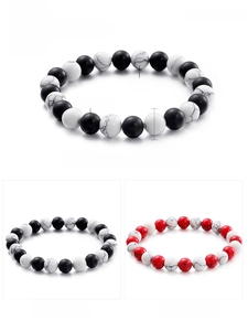 Detailed view of 8mm matte black agate and turquoise beaded bracelet with 16g weight