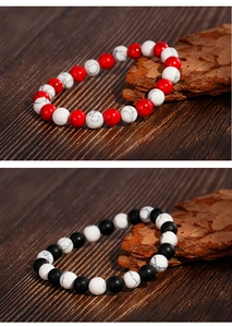 Detailed macro view of 8mm matte black agate and white turquoise beaded bracelets for men