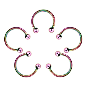 Macro shot of five rainbow metallic horseshoe rings arranged in a floral pattern design