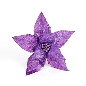 Sparkling purple poinsettia Christmas flower with silver glitter for holiday decoration