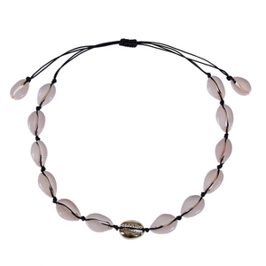 Bohemian shell necklace with black braided cord and golden metallic shell detail