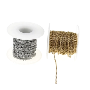 Detail view of silver and gold stainless steel link chains wound on plastic spools