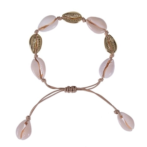 Detail of woven shell necklace with natural conch and golden beads on adjustable cord