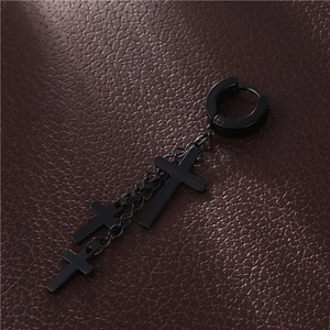 Detail view of black punk titanium steel chain earrings with three cross pendants
