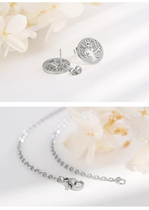 Detailed view of silver tree of life earrings and matching necklace jewelry set