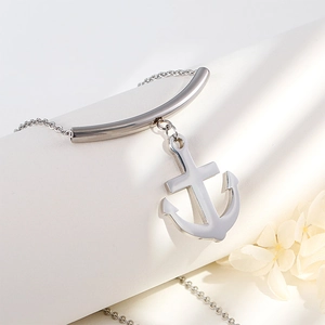 Silver anchor pendant necklace made of polished titanium steel on white floral background