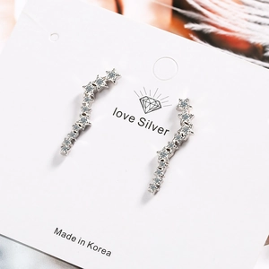 Sparkling silver star curved crawler earrings with cubic zirconia on white display card