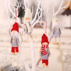 Set of 4 knitted Christmas gnome ornaments hanging on white branches for festive decor