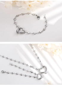 Polished silver heart pendant necklace and bracelet set with delicate beaded chain detail