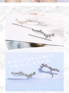 Detailed macro view of silver star earrings with sparkling crystals in high-quality finish