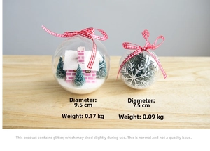 Detail of clear Christmas ball ornaments with miniature trees and red checkered bows