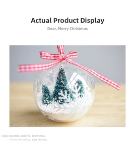 Detailed view of clear Christmas ornament with mini tree and festive red plaid ribbon bow
