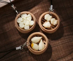 Macro detail of realistic Chinese dim sum steamer keychain with translucent food textures