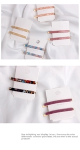 Set of minimalist acetate hair clips in assorted floral and marble patterns on silk