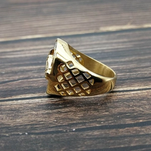 Detailed view of gold plated horse head ring featuring side hollow mesh grid patterns