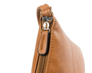 Close-up of brown leather bag showing fine stitching and gold metal zipper detail